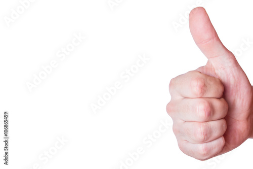 Man`s hand showing thumb up on white background with empty copy space on the left. photo