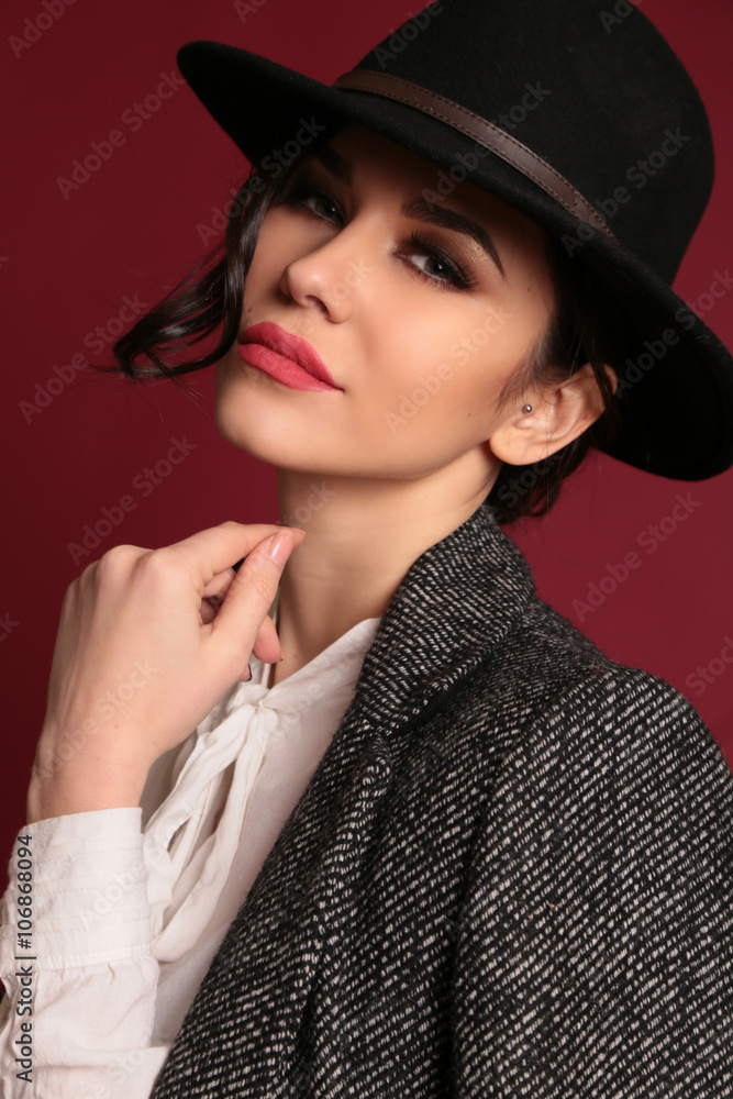 gorgeous woman with dark hair and evening makeup in elegant clothes gorgeous woman with dark hair and evening makeup in elegant clothes