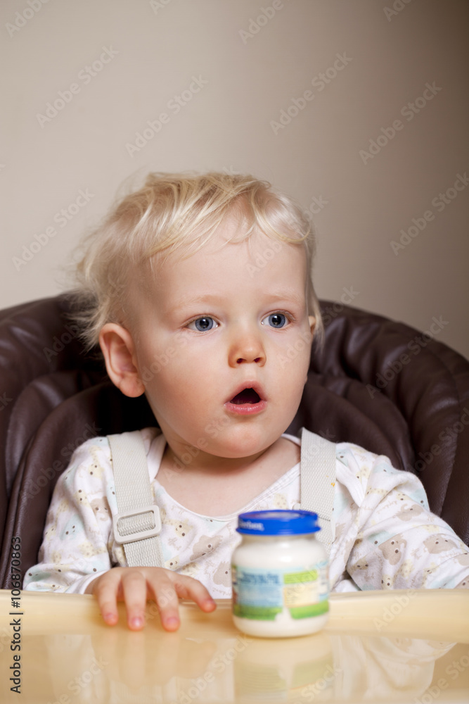 Two year baby boy sitting at the dinner table Two year baby boy sitting at the dinner table