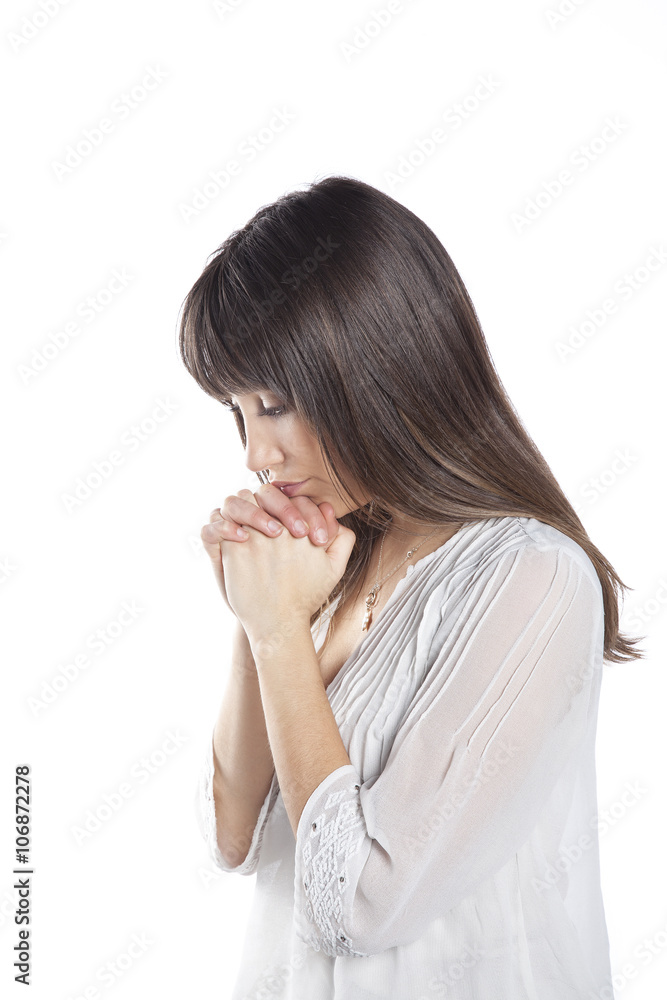 A worried woman praying. Isolated on white background. Problems concept A worried woman praying. Isolated on white background. Problems concept