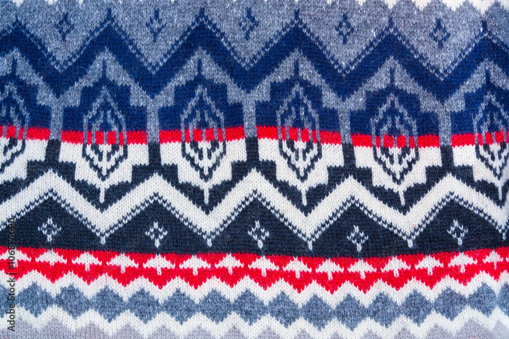 background of wool with red, white, gray, blue geometric patterns background of wool with red, white, gray, blue geometric patterns