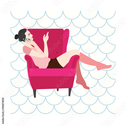 Woman sitting in a chair talking on the phone