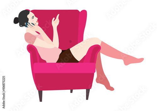 Woman sitting in a chair talking on the phone