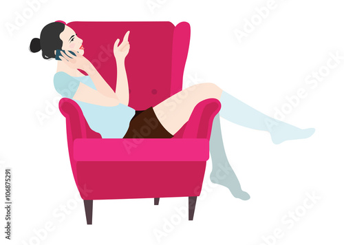 Woman sitting in a chair talking on the phone