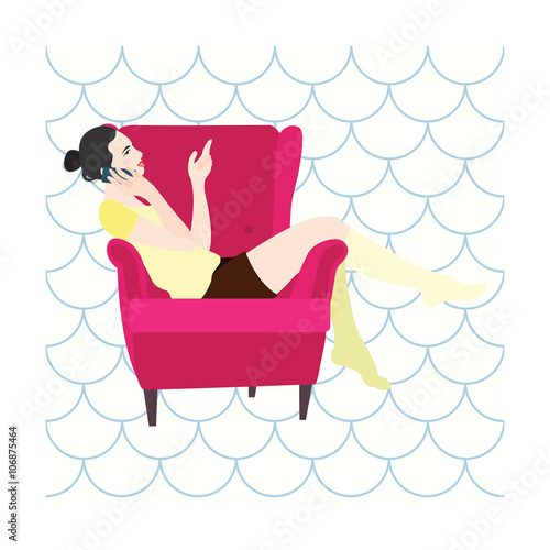 Woman sitting in a chair talking on the phone