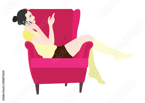 Woman sitting in a chair talking on the phone