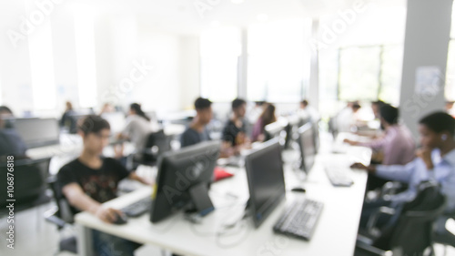 Blurry background of group people using computer in white comput