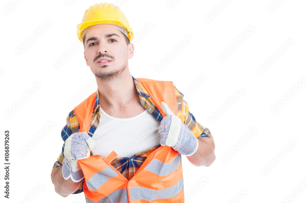 Handsome engineer acting like a super hero in his workwear Handsome engineer acting like a super hero in his workwear