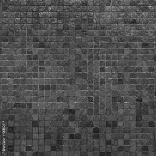 Grey and black mosaic wall texture and background..