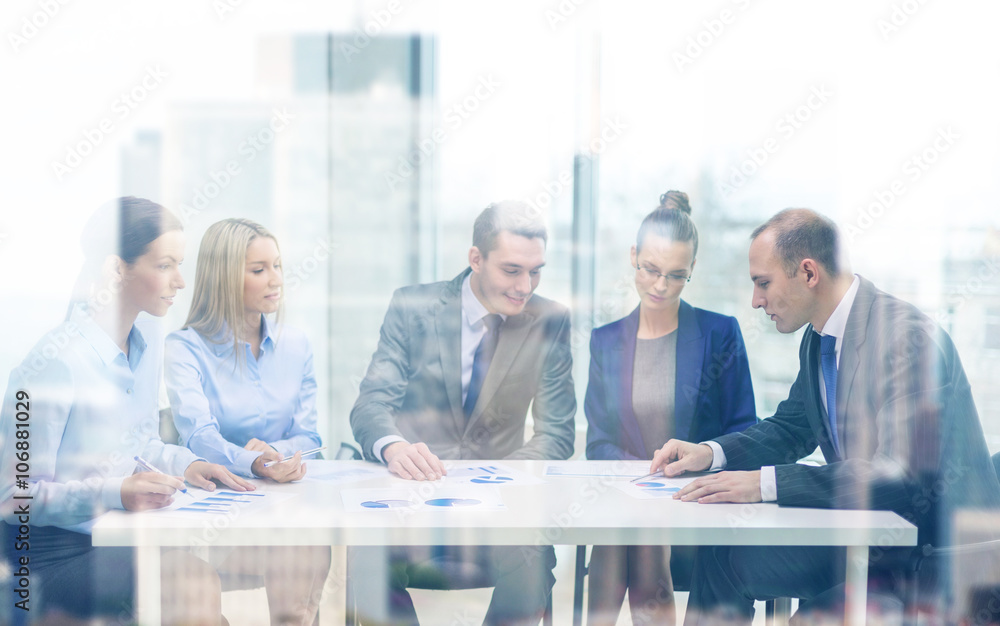 business team with documents having discussion