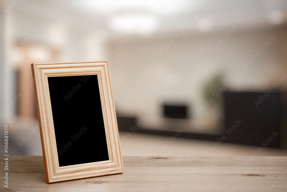photo frame on the wooden table - obrazy, fototapety, plakaty 