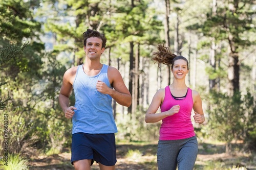 Young smiling couple jogging 