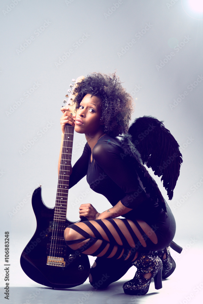 black girl, black angel with electric guitar