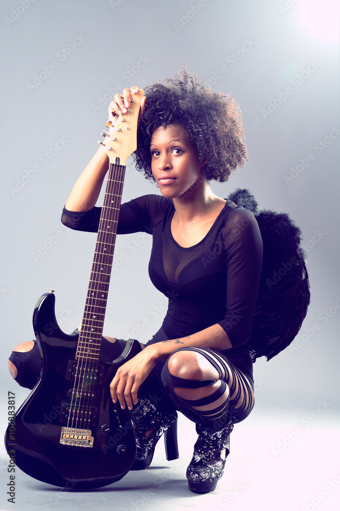 Fototapeta premium black girl, black angel with electric guitar