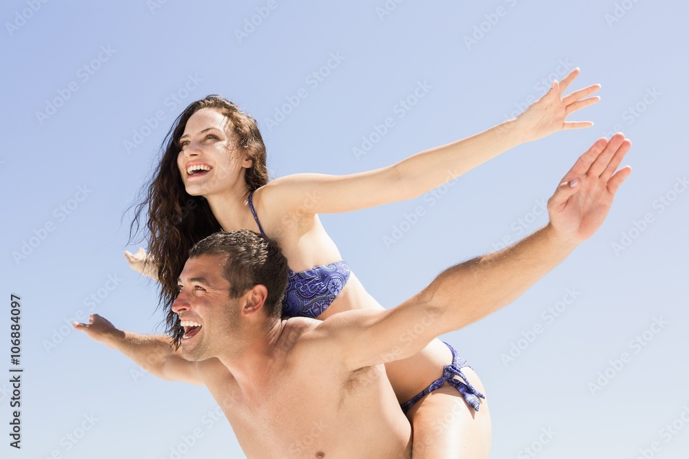 Boyfriend giving piggy back to girlfriend Boyfriend giving piggy back to girlfriend