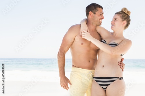 Couple hugging on the beach