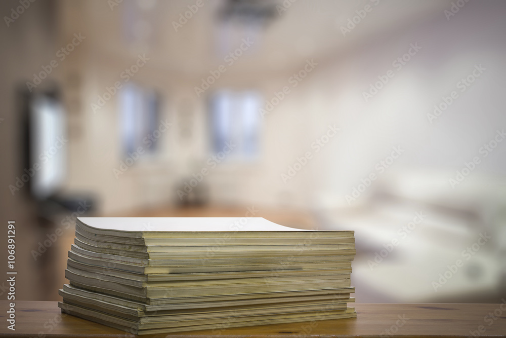stack of old magazines on wooden table stack of old magazines on wooden table