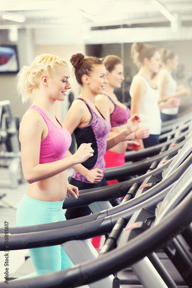 Group of women jogging on treadmill Group of women jogging on treadmill