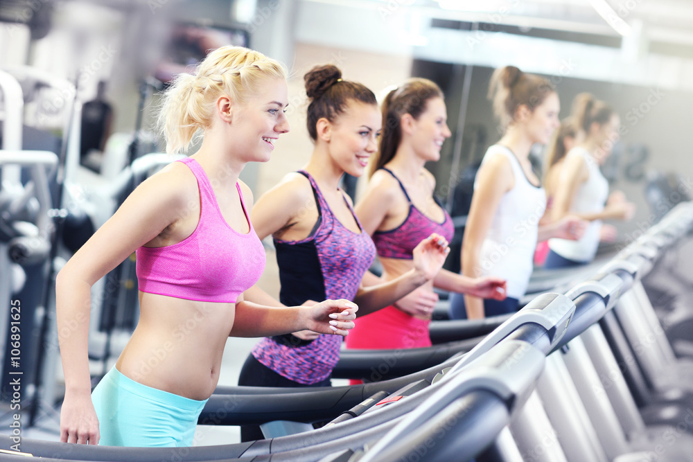 Group of women jogging on treadmill Group of women jogging on treadmill