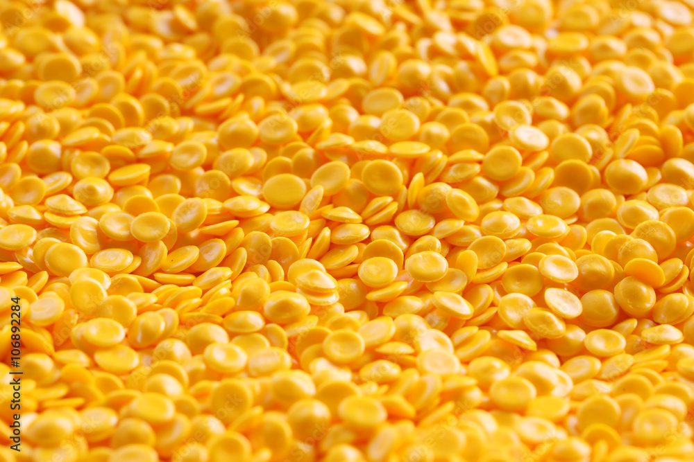 yellow plastic pellets background. yellow plastic pellets background.
