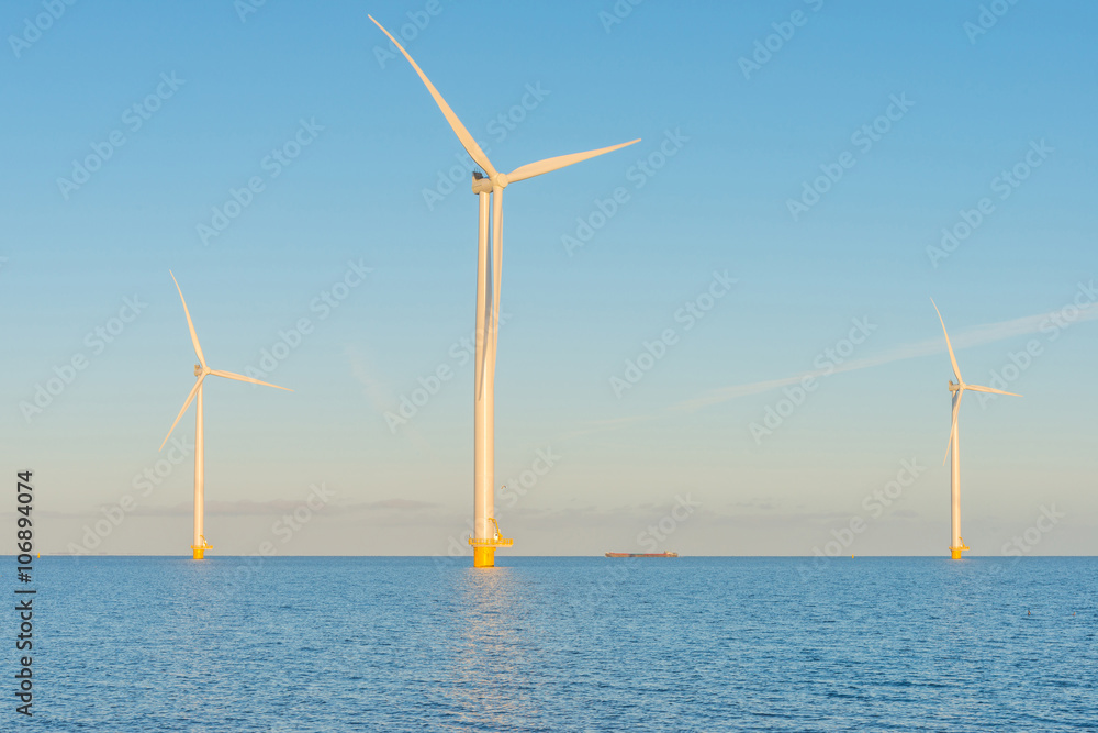 Wind turbines in a lake at sunrise