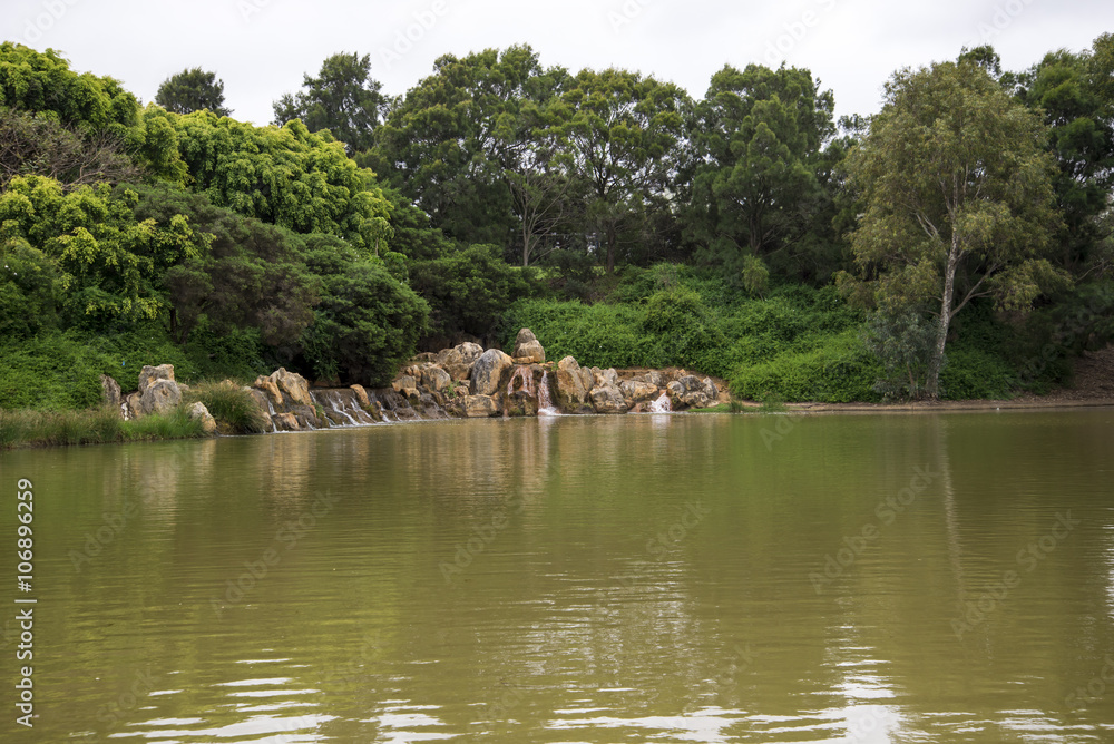A small scenic pond with watefalls and rocks near Joondalup HBF