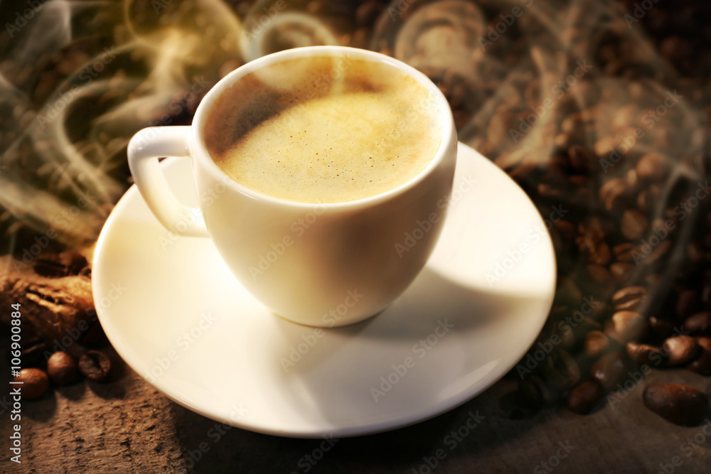 Cup of coffee and grains, closeup Cup of coffee and grains, closeup