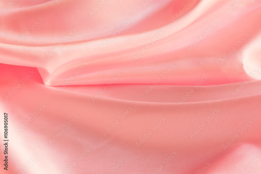 Obraz premium Shiny Pink silky fabric folds background texture