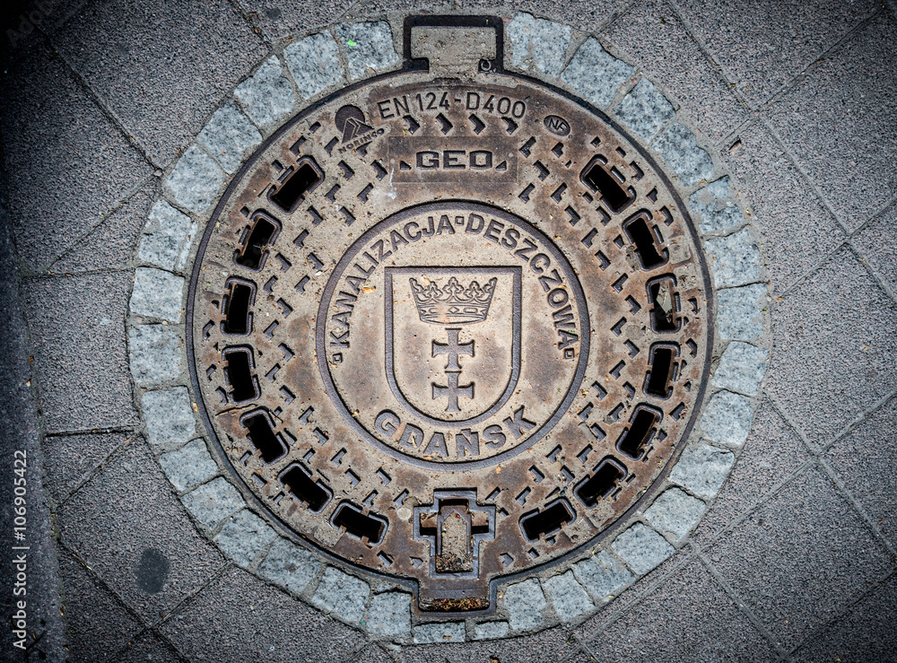 Cover of sewer shaft in Gdansk, Poland, Europe. Cover of sewer shaft in Gdansk, Poland, Europe.