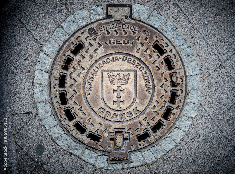 Cover of sewer shaft in Gdansk, Poland, Europe.