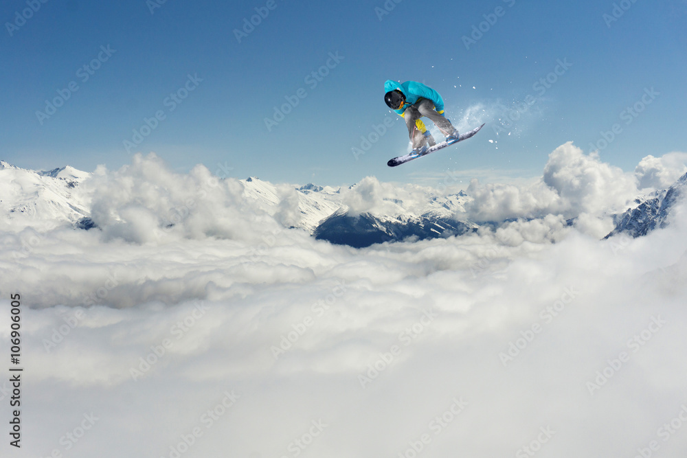 Snowboarder jumping on mountains. Extreme sport. Snowboarder jumping on mountains. Extreme sport.