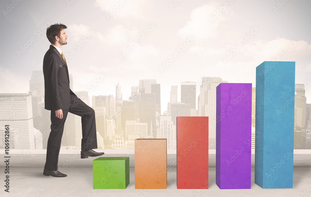 Business person climbing up on colourful chart pillars concept Business person climbing up on colourful chart pillars concept