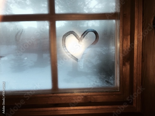 Bilde på lerret Heart on moisture window. Interior cabin winter view.