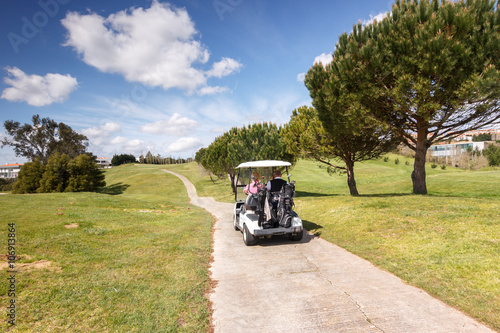 Golf sport, golf course with a cart and beautiful landscape © Henrique Silva