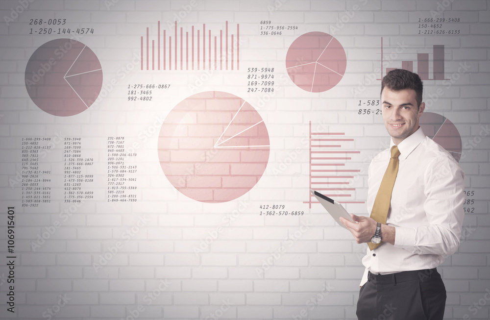 Pie charts and numbers on wall with salesman Pie charts and numbers on wall with salesman