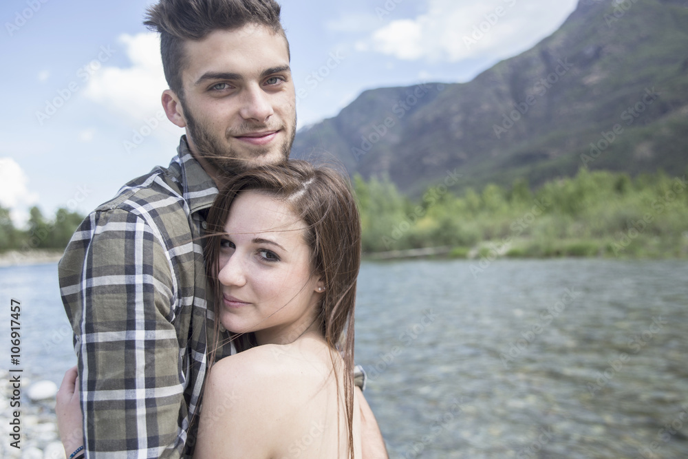 Portrait of young couple on Toce riverbank, Piemonte, Italy Portrait of young couple on Toce riverbank, Piemonte, Italy