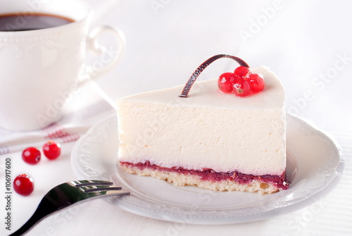 tasty piece of cake with berries in saucer