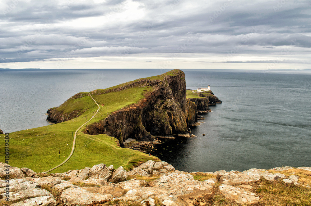 Fototapeta premium Neist Point, Scotland - Lighthouse on a rock above the sea.