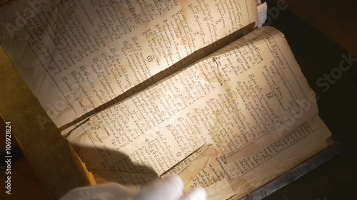 Hands in Gloves Leafing Through Book Scientist With Patericon of Kiev-Pechersk Lavra Stories of a Lives of the Lavra's Saints Ancient Book Slavic Manuscript