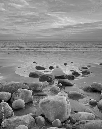 Beach rocks leading to the sea