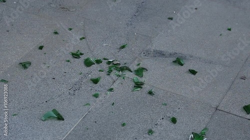 Wallpaper Mural slow motion smashing green bottle on asphalt Torontodigital.ca