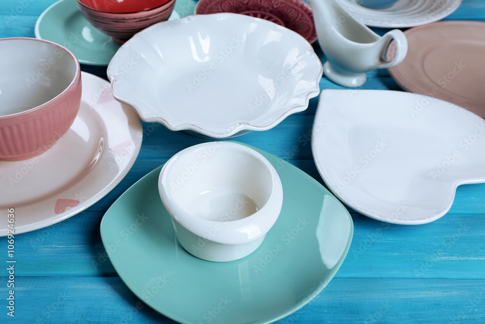Different tableware on wooden table close up Different tableware on wooden table close up