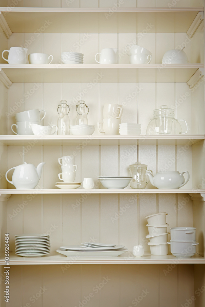 Dishes in cupboard in the kitchen Dishes in cupboard in the kitchen
