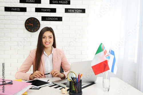 Young woman with laptop in ...