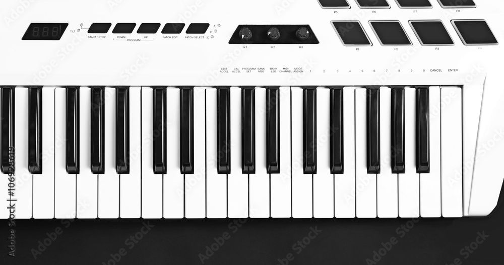 Fototapeta premium Keyboard of synthesizer on black background
