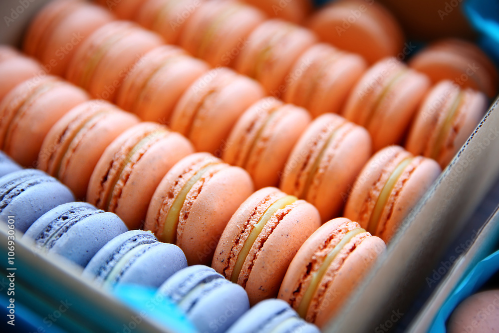 Varicolored tasty macaroons in a box, close up Varicolored tasty macaroons in a box, close up