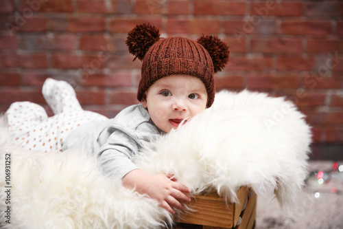 Adorable baby in brown knit...