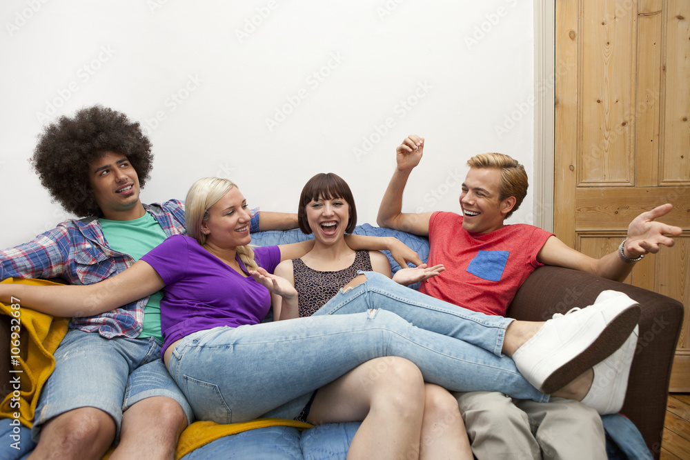 Flatmates reclining on sofa Flatmates reclining on sofa