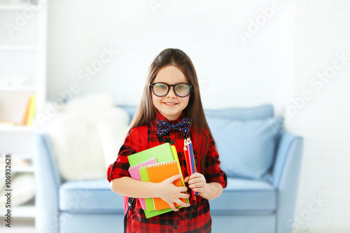 Little girl with red back p...