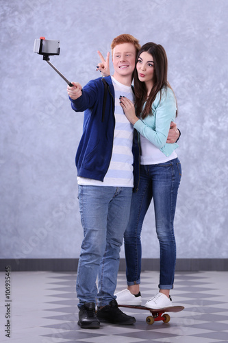 Teenager couple with skateb...